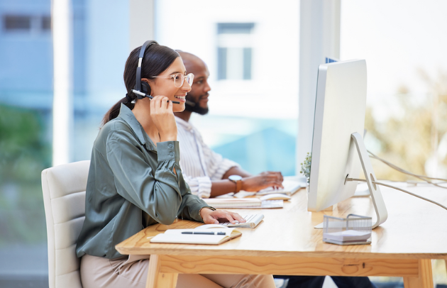 Shot of two businesspeople working together in a call center